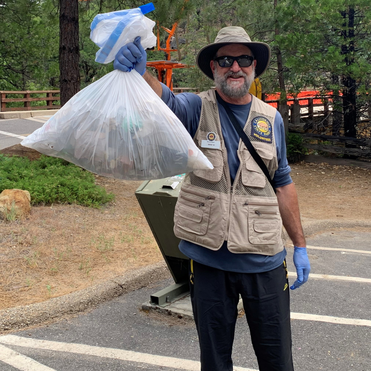 Volunteer holding trash bag